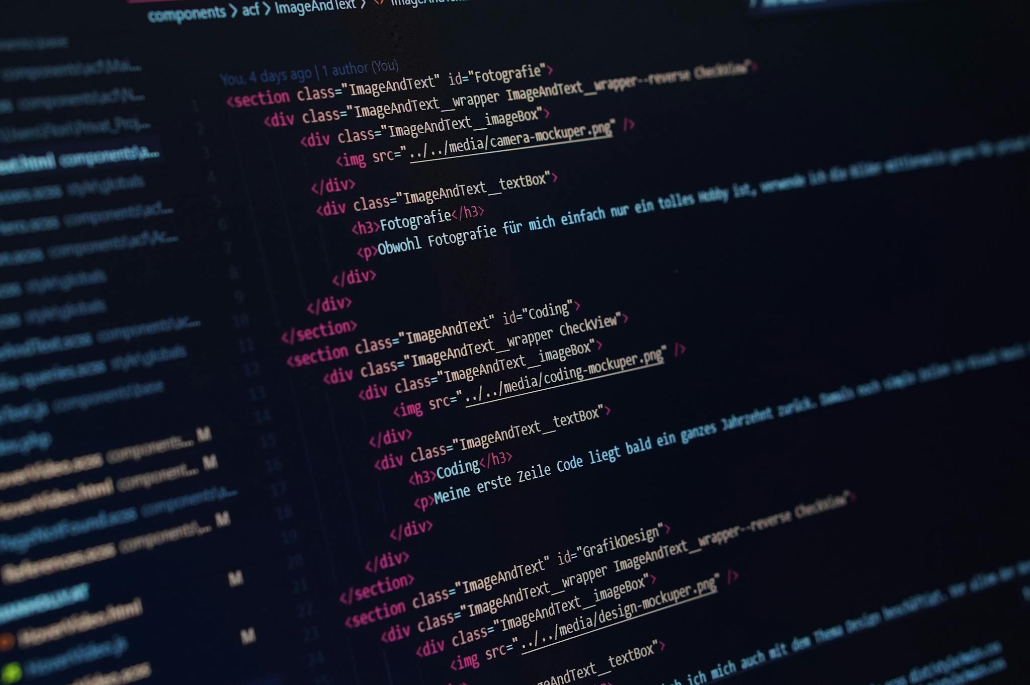 Close-up view of HTML code displayed on a dark screen, showcasing coding concepts.